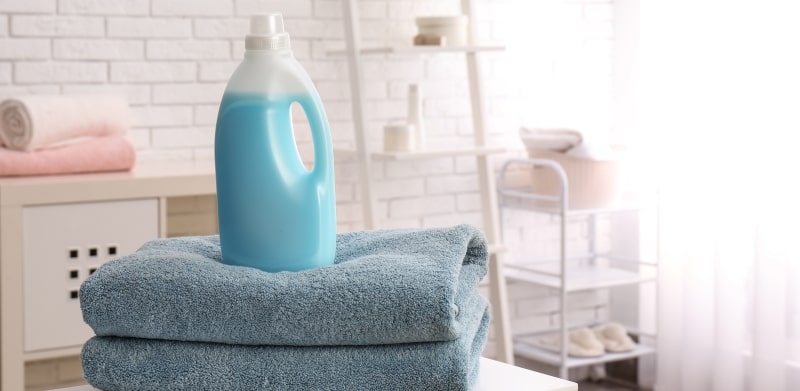 Laundry Detergent Bottle On Towels Min